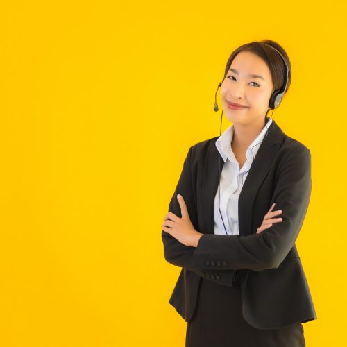 portrait-beautiful-young-business-asian-woman-with-headphone-headset